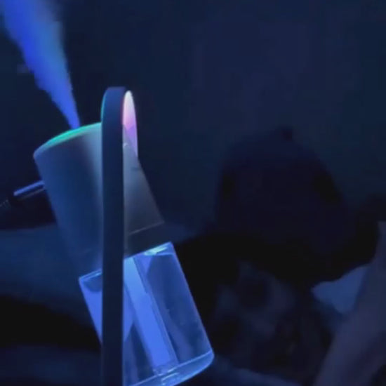 Lumaveil Veilmist humidifier creating ambient mist lighting for bedroom relaxation