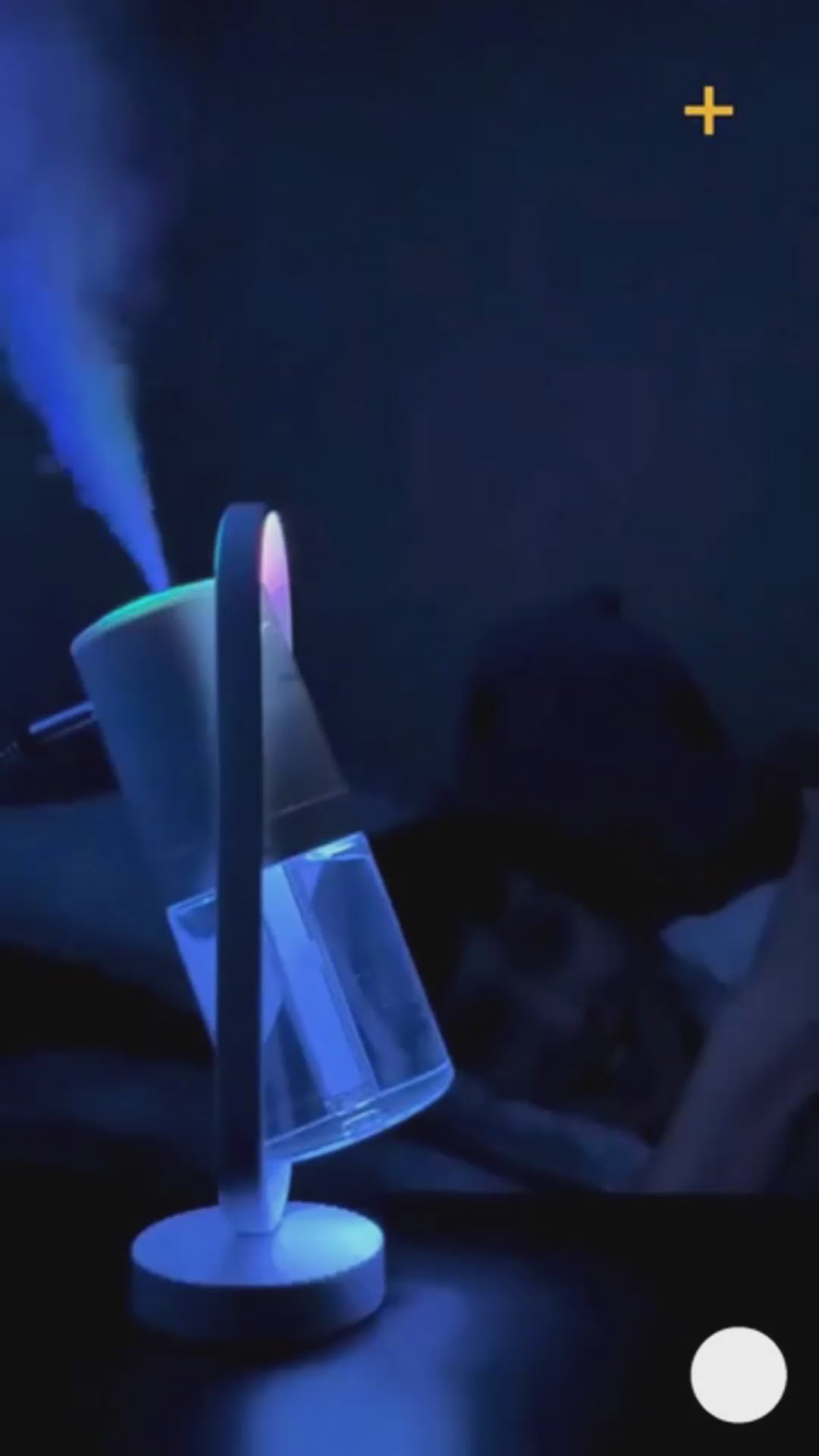 Lumaveil Veilmist humidifier creating ambient mist lighting for bedroom relaxation